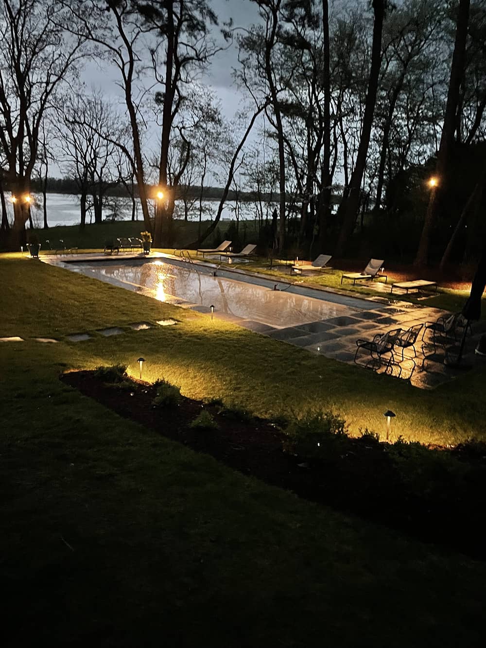 Landscape lighting installed along front walkway of a Worcester County home
