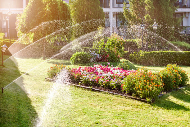 Technician adjusting irrigation system on suburban Grasonville, MD residential property