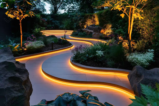 Technician installing outdoor landscape lighting in Hurlock, MD garden
