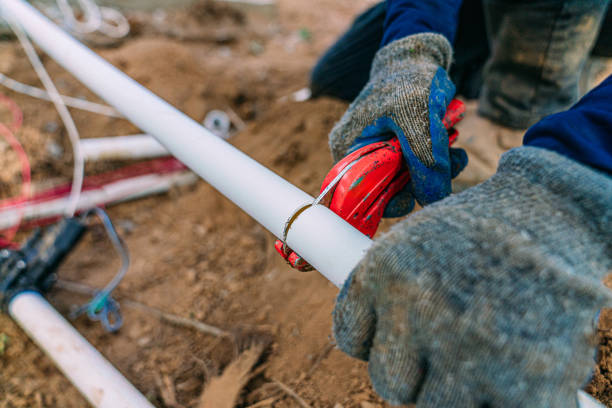 Miles Creek Irrigation technician repairing underground sprinkler line