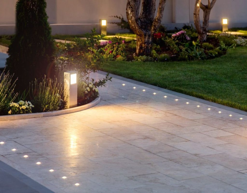 Landscape lighting Queenstown MD home with path and garden