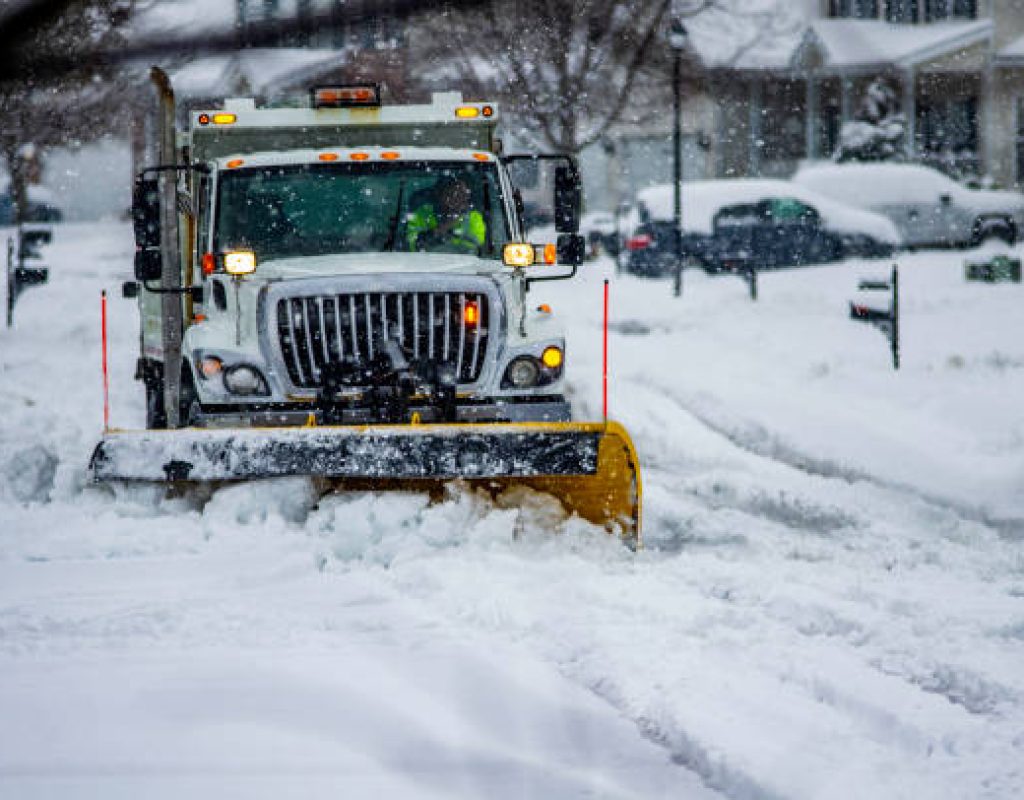 winter snow removal technicians ensuring safer paths around customer properties consistently