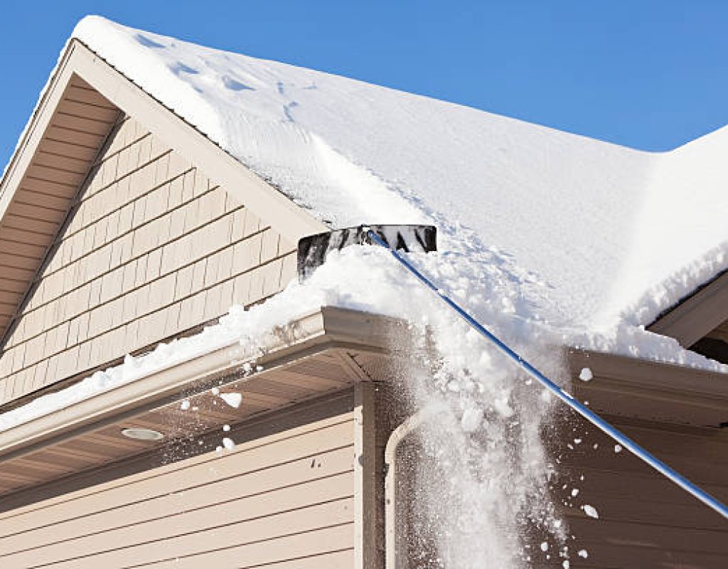 Heavy-duty snow plowing equipment Miles Creek Irrigation and Lighting operators