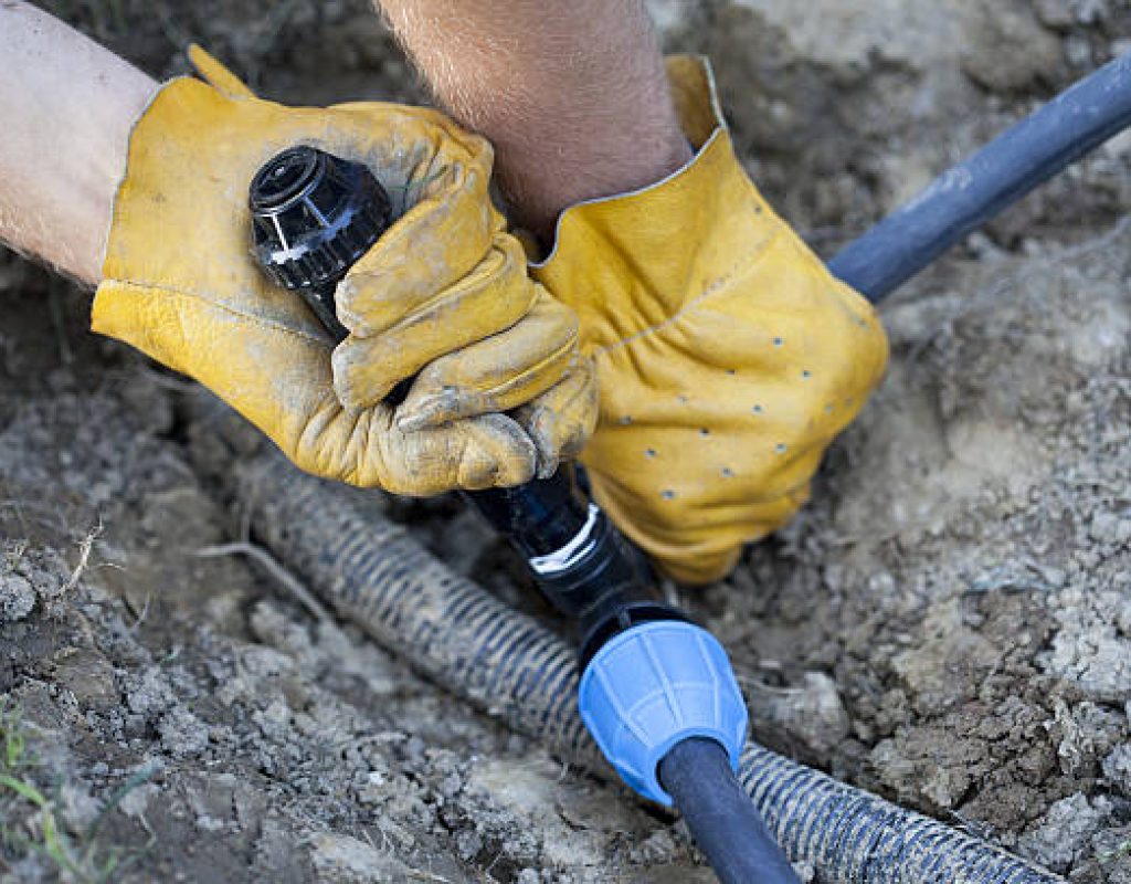 Local sprinkler system repair service by Miles Creek Irrigation and Lighting technician