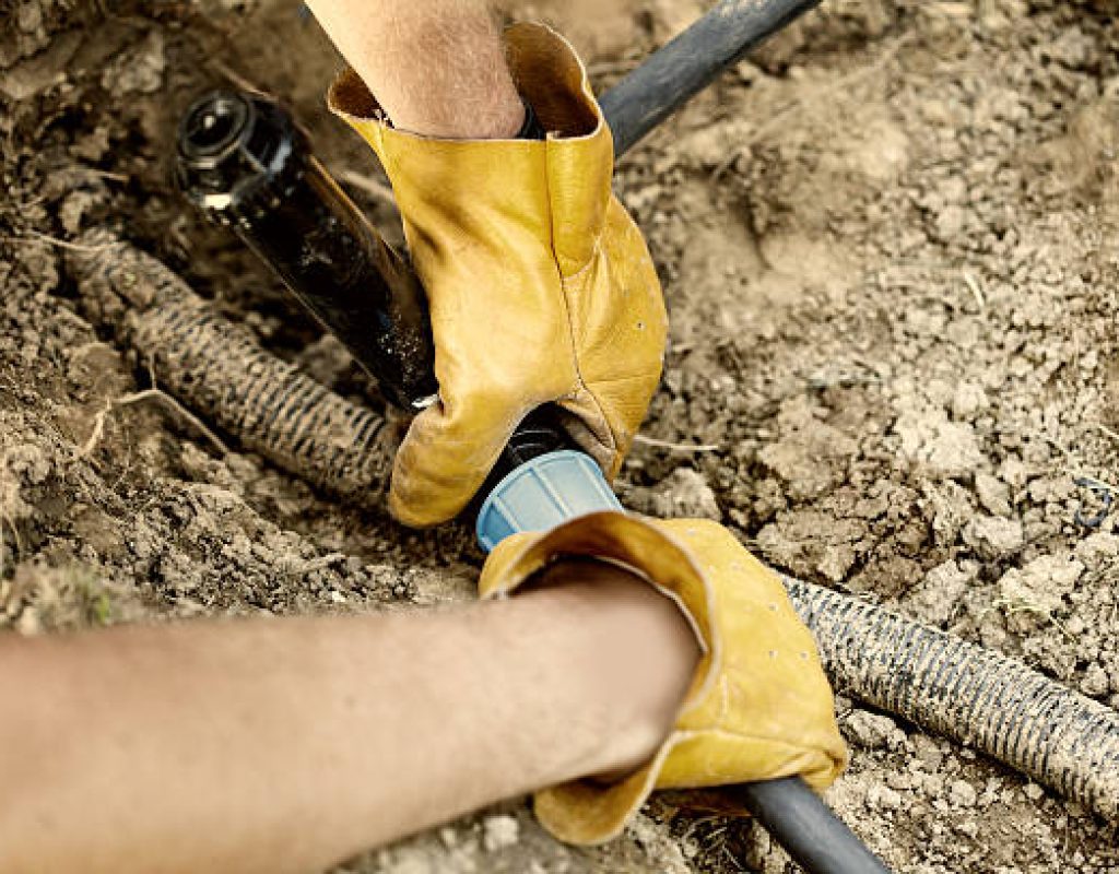 Irrigation professional testing sprinkler system after repair