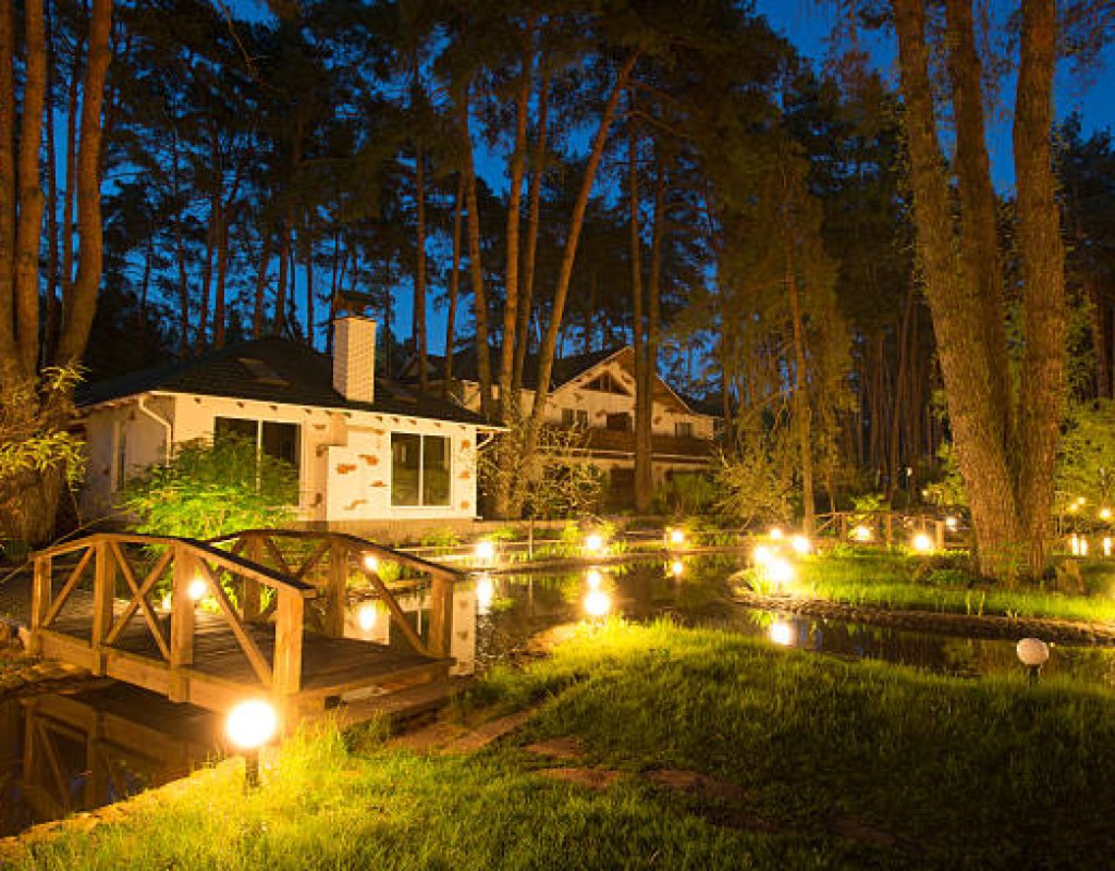 Technician installing elegant garden lighting at Easton, MD property