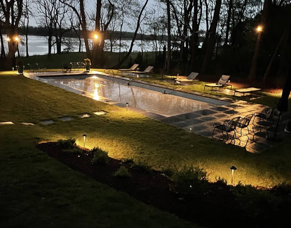Landscape lighting installed along front walkway of a Worcester County home